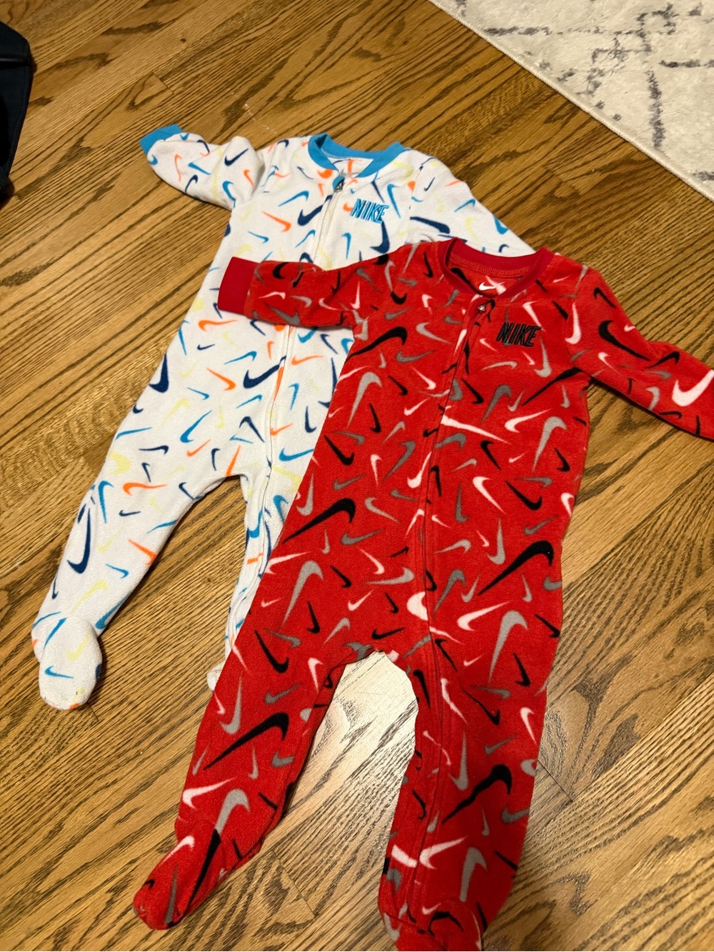 2 Nike Baby Footed Pajamas with Multicolor Swoosh and Red & White Print